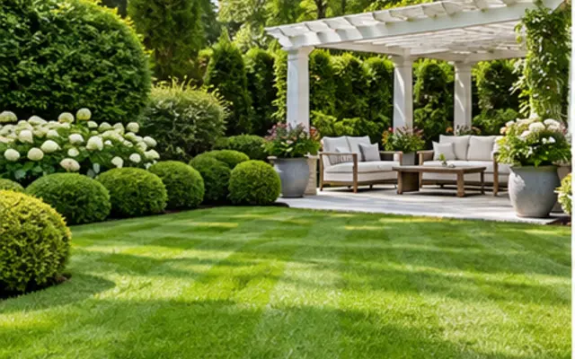 Landscaped garden with lawn, hedges and outdoor seating
