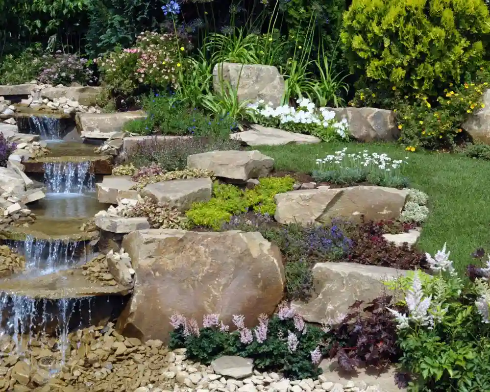 professionally designed natural stone cascading rock garden waterfall in western ny