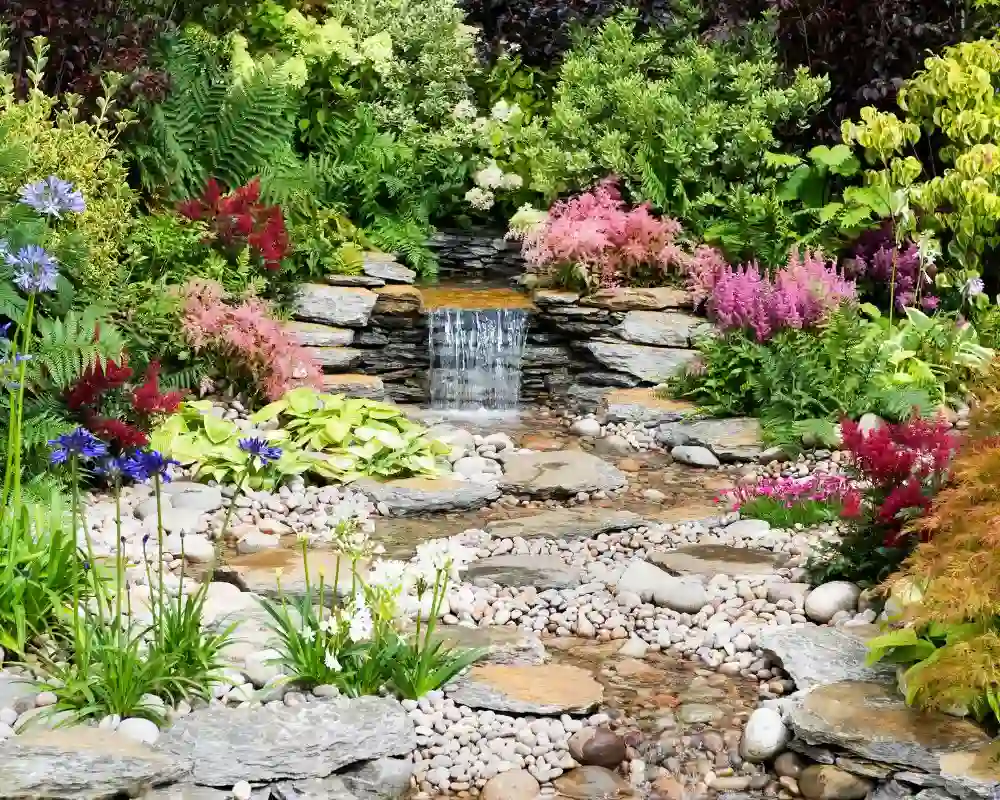professionally built backyard stream and rock garden water feature in clarence ny
